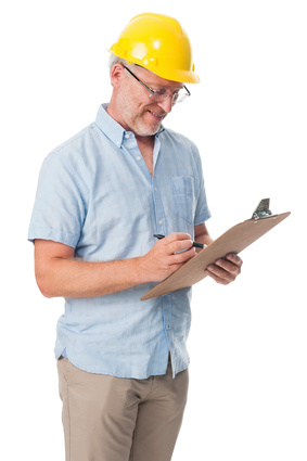 Man in Hardhat Consults a Generator Load Size Guide