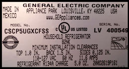 Nameplate for a refrigerator with installation clearances and electrical specifications in volts and amps.